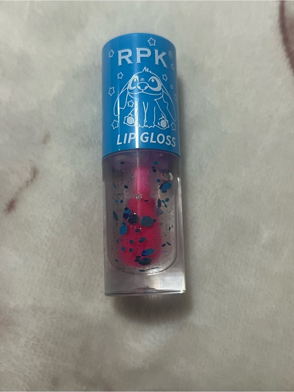 RPK Lip Gloss in PinkClear with Blue Glitters